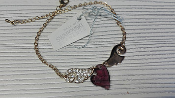 Стильный позолоченный браслет  с сердечком ,с кристаллами Swarovski