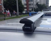 Багажник Атлант для Ford Focus 2, универсал с интегрированными рейлингами (крыловидная дуга)
