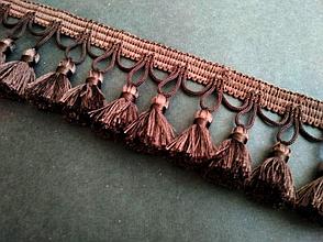 Бахрома декоративная фиолетово - коричневого цвета цвета.