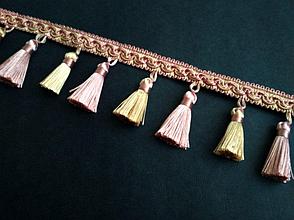 Бахрома декоративная золотисто - розового цвета.