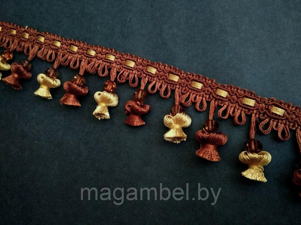 Бахрома декоративная рыжего с желтым цвета .