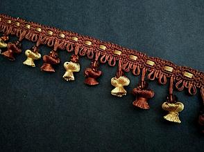 Бахрома декоративная рыжего с желтым цвета .