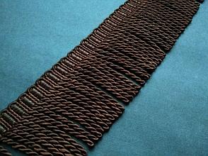 Бахрома декоративная темно - коричневого цвета.