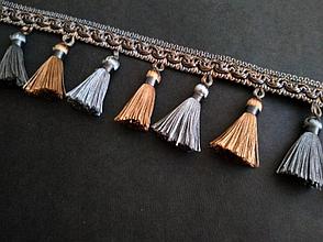 Бахрома декоративная золотисто - голубого цвета.