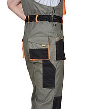 Полукомбинезон СИРИУС-МАНХЕТТЕН оливковый с оранжевым и чер. тк. мех. стрейч пл 260 г/кв.м, фото 2