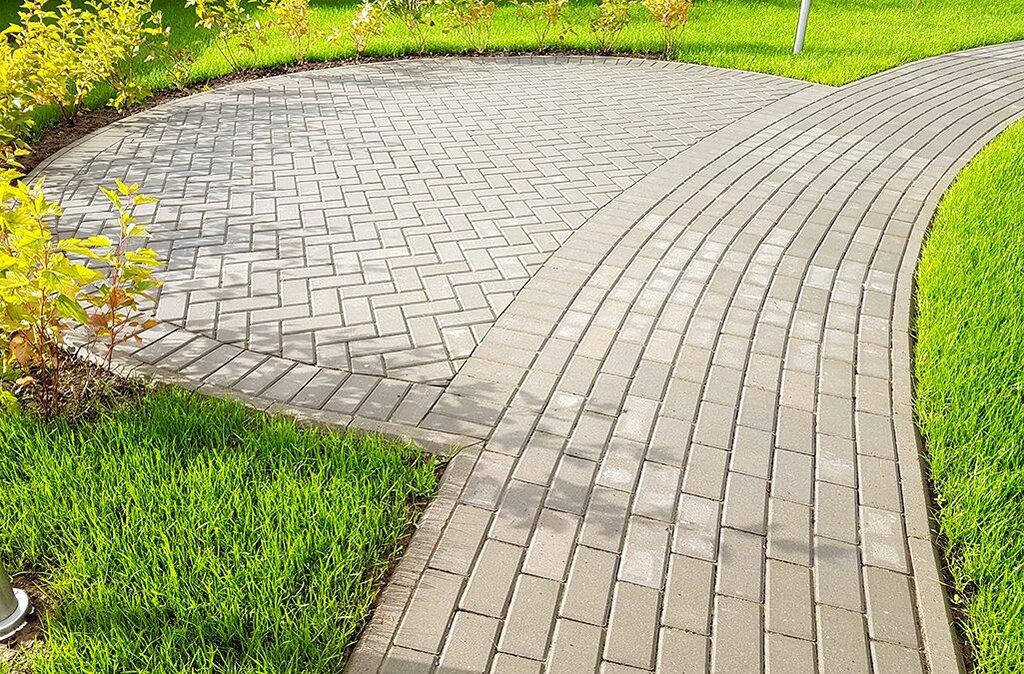 Tetris inspired pathway with grey brick and gravel, pressure treated wood edging