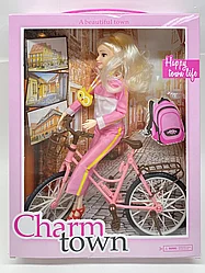 Кукла на велосипеде