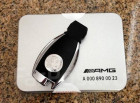 Аксессуар Mercedes-Benz Оригинальная накладка на ключ с гербом AMG A0008900023 - фото 1 - id-p188357188