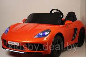 Детский электромобиль RiverToys Porsche Cayman T911TT (оранжевый глянец) автокраска двухместный