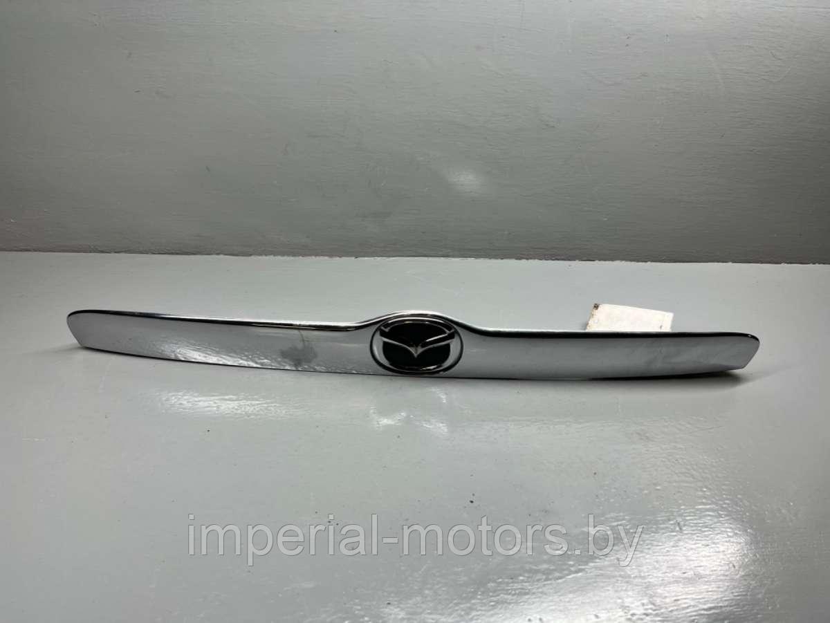 Накладка подсветки номера Mazda Tribute 1 - фото 1 - id-p219586035