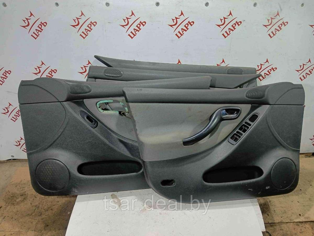 Обшивка двери задней левой (дверная карта) Seat Toledo 2 (1M0867211, 1M0867212, 1M0867012, 1M0867011) - фото 1 - id-p224823100