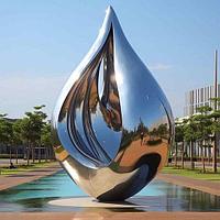 Абстрактная скульптура из нержавеющей стали - Притяжение