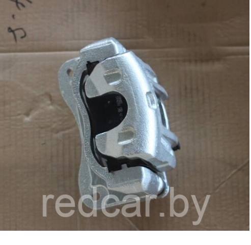 Суппорт тормозной передний левый Geely Atlas