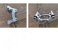 Скоба суппорта заднего правого с направляющими (серебро) Geely Coolray/BelGee X50