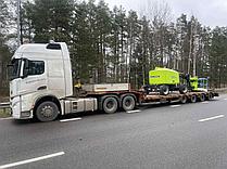 Трал для перевозки строительного подъемника