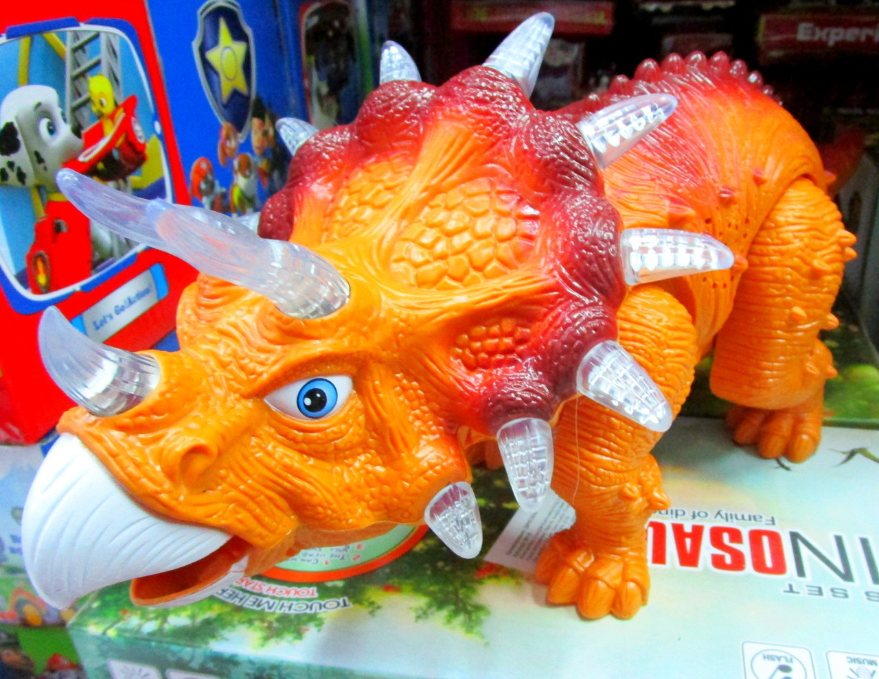 Игрушка Динозавр. Трицератопс.(муз.свет.ходит.)35см