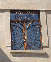 Решетки на окна с коваными завитками модель 162
