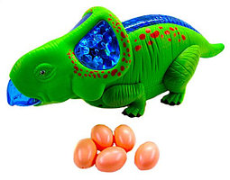 Игрушка муз.динозавр ходит.несет яйца